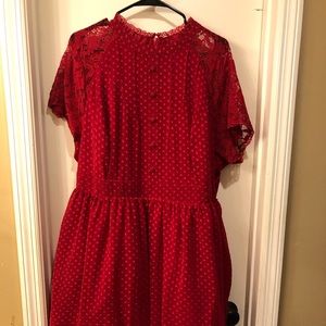 Red fifties style dress with short sleeves.